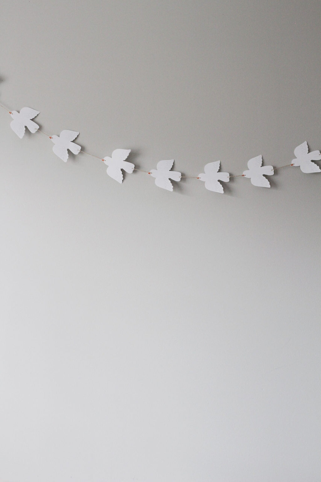 paper doves on a string