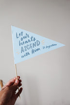 Let our hearts ascend with him quote by st augustine on a pennant
