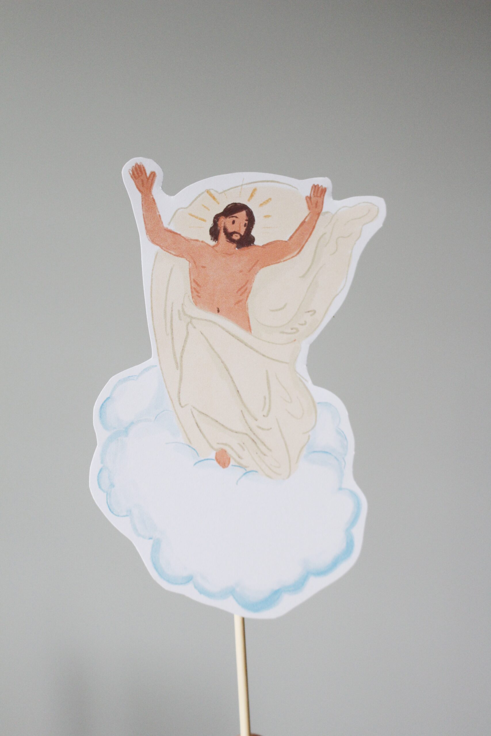 Printed illustration of Jesus ascending into heaven on a cloud